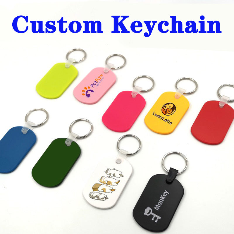 Collection of colorful custom keychains with various designs on a white background.